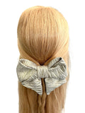 Gold zig zag patterned oversized hair bow 